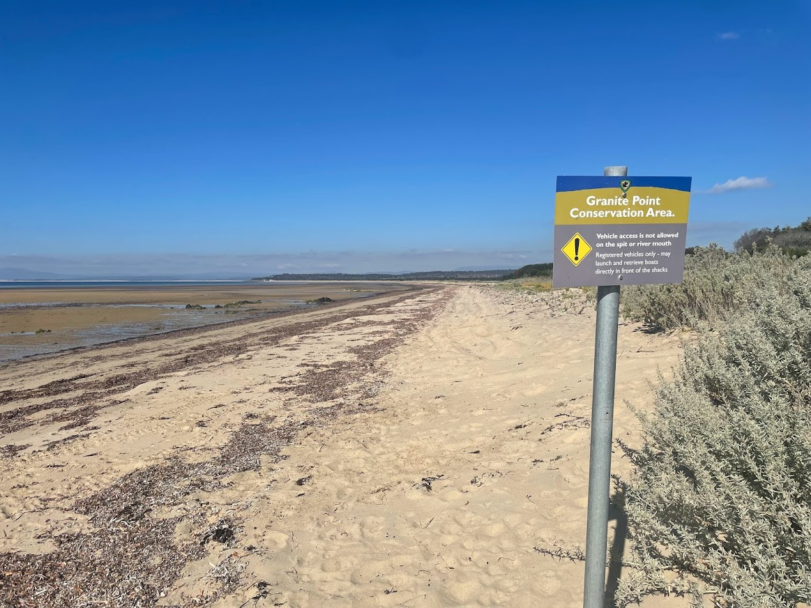 Signage indicating I couldn't ride along the beach to Bridport